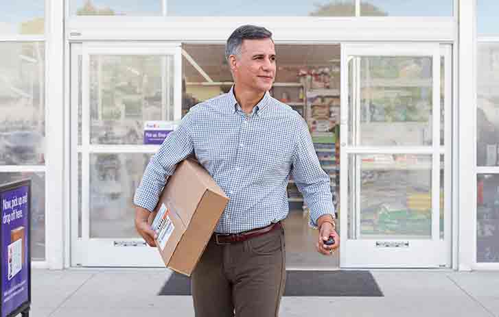 Customer picking up a package at a dropbox
