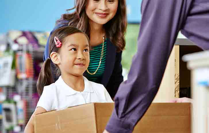 Mother and child dropping package off.