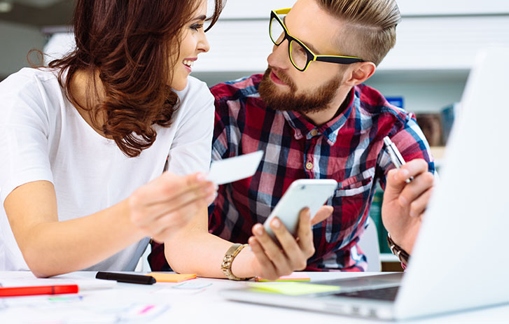 Couple at laptop working business card