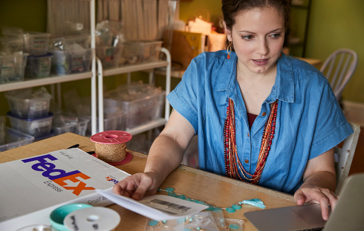 Woman with FedEx supplies