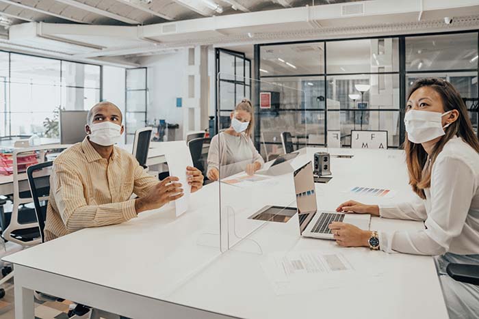 Office workers in masks at meeting