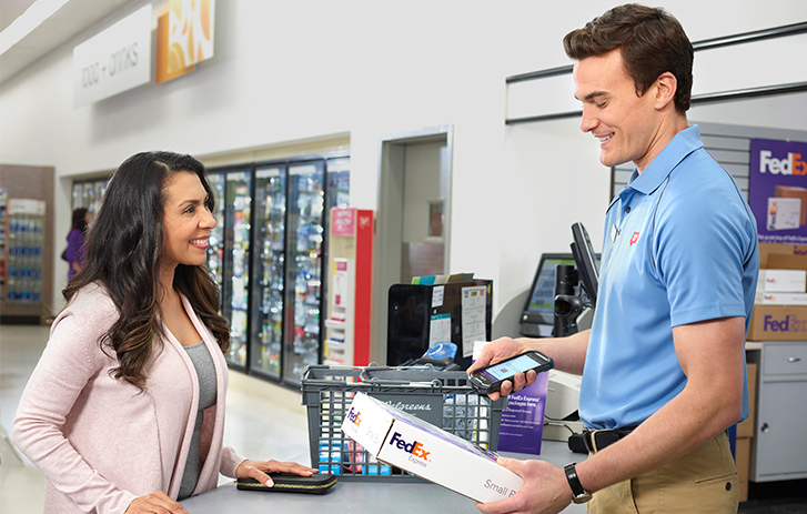 FedEx employee helping a customer