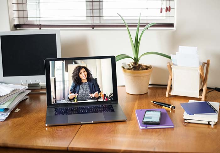 Woman shown on laptop screen
