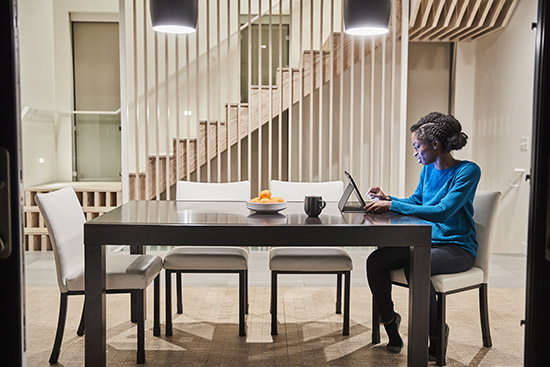 Woman on tablet at home table