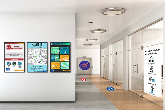Office hallway with social distancing signage