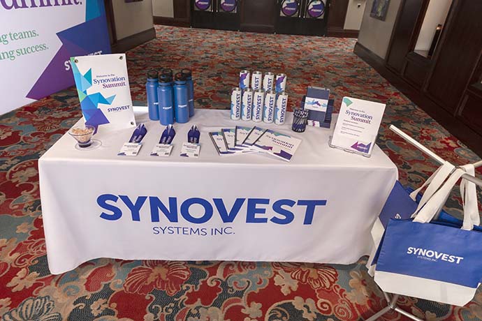 Event welcome table holding branded swag