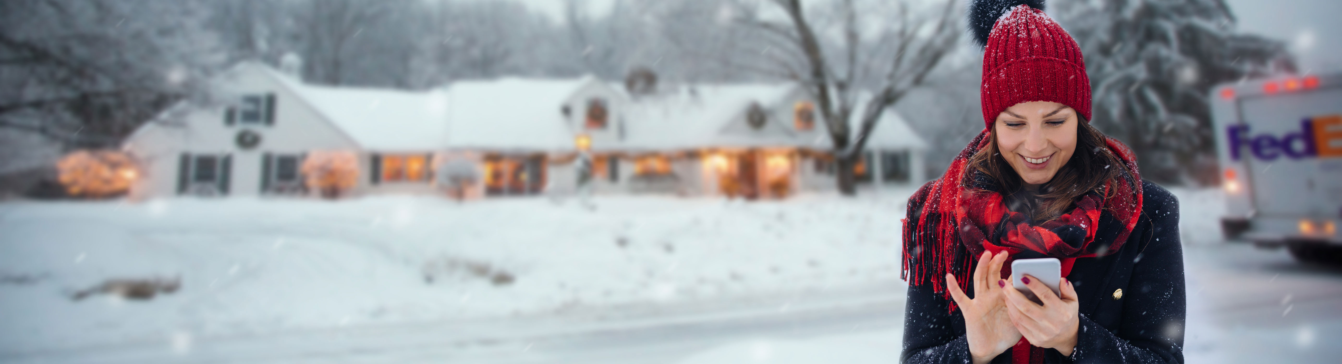 Woman on phone in the snow