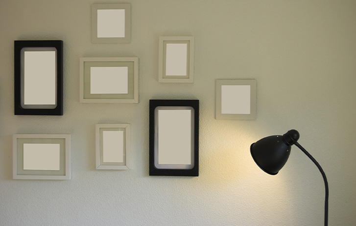 Gallery wall of classic empty frames on white wall Gallery wall of classic empty frames on white wall