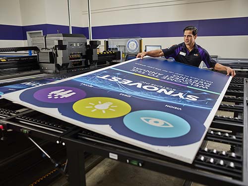 Man holding large banner