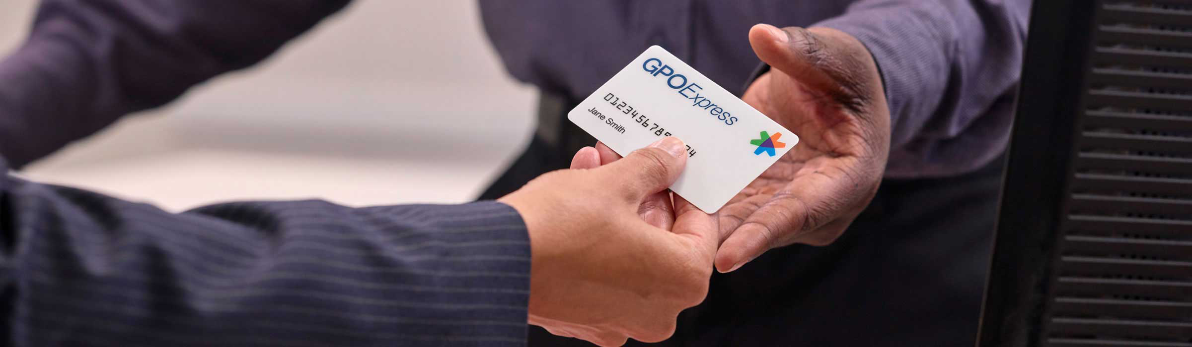 A person holding a Government program card
