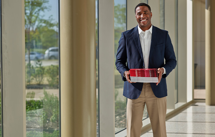 Biusiness Solutions Man holding book