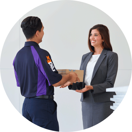 FedEx Office team member receiving a package