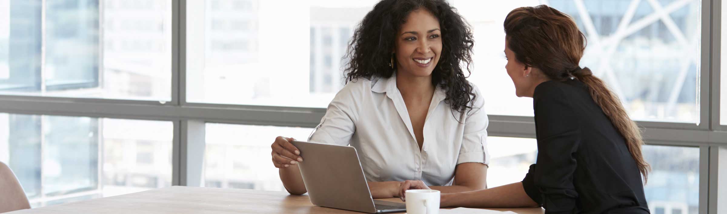 Two women working at a desk