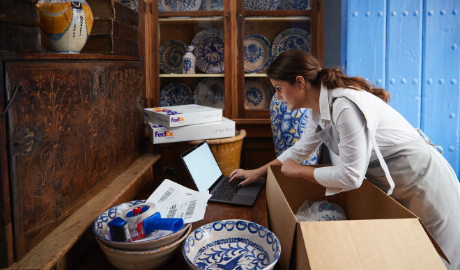 woman packing glass dishes