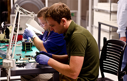 technicians working on hardware