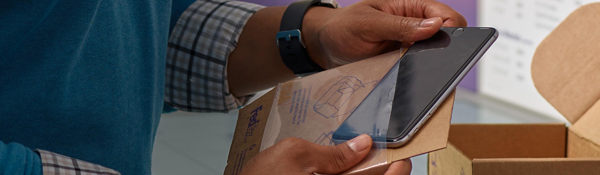 Person removing phone from package