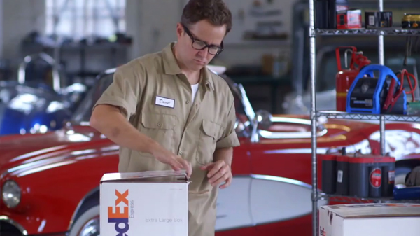 Man opening up FedEx box