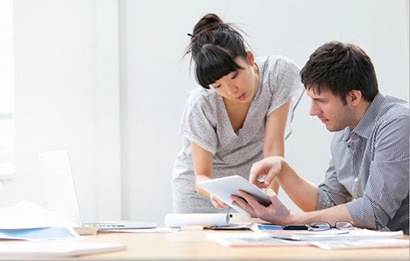 coworkers reviewing invoices