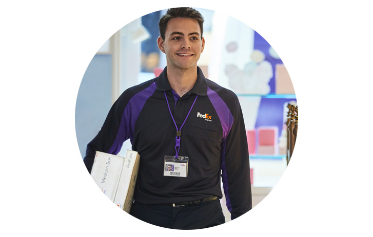 fedex delivery driver carrying packages