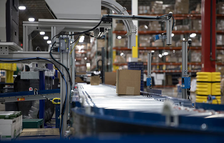 boxes on assembly line in warehouse