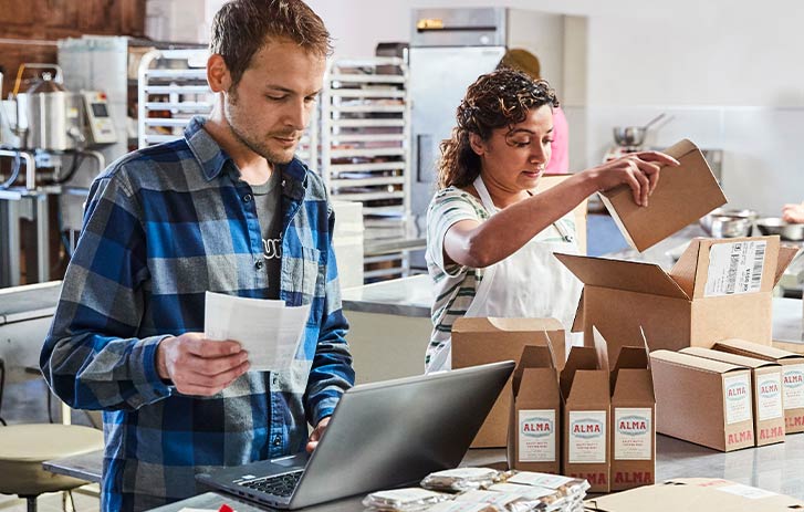 business owners packing shipments