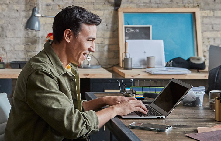 Man typing on laptop