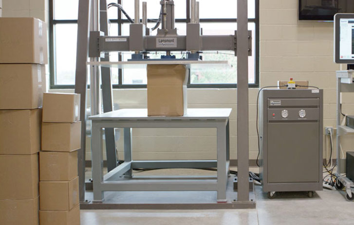 packages being tested for durability by machine