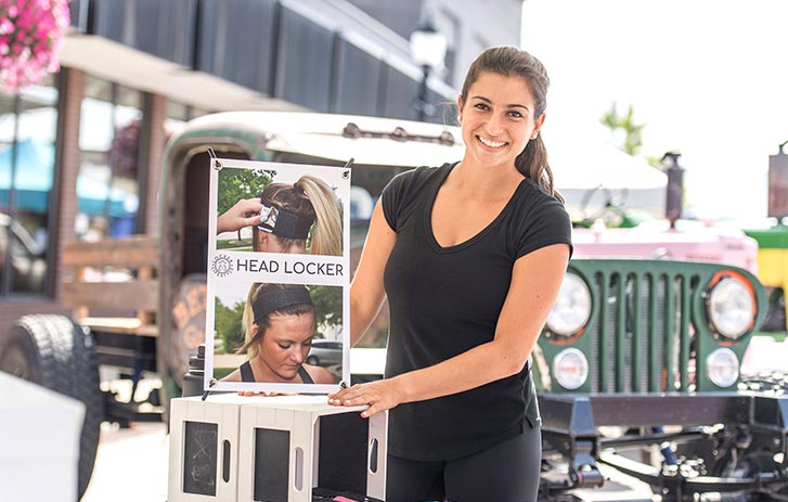 A photo of Kat Samardzija displaying her Head Locker product