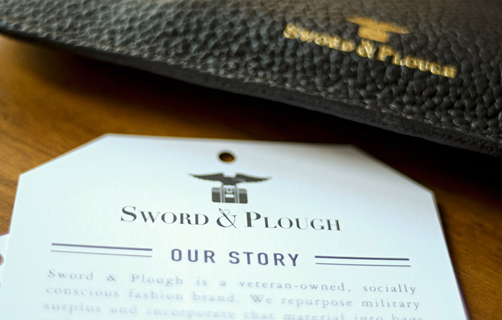 A photo of a custom-printed insert for Sword & Plough
