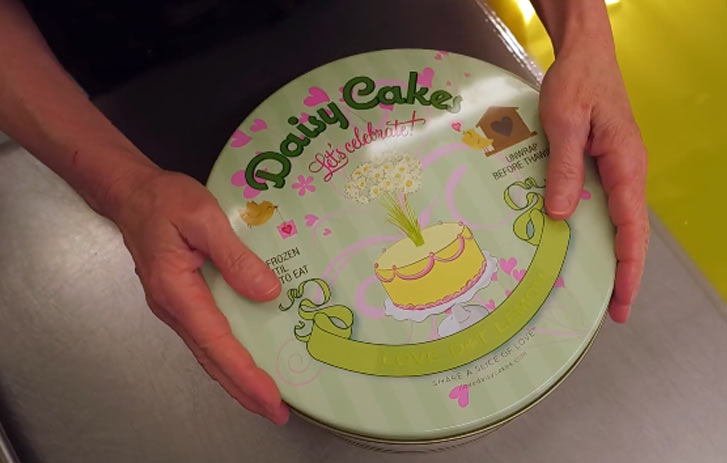 Small business owner baking a cake and packaging for shipment via FedEx