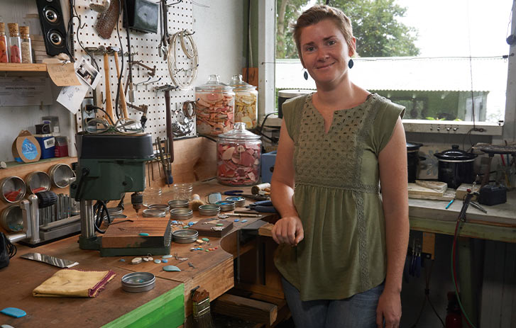 Nurdle in the Rough A photo of Kat Crabill, founder of Nurdle in the Rough, in her jewelry workshop