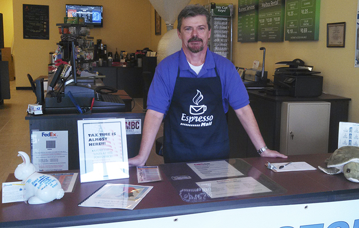 Norman Froscher, co-owner of Espresso Mail in West Palm Beach, Florida.