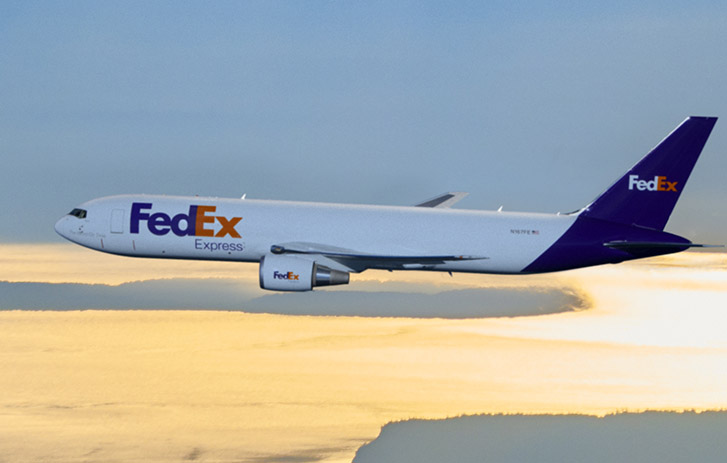 A FedEx Express airplane flying in the sky
