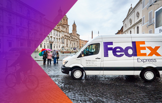 FedEx van in front of people in a European city.