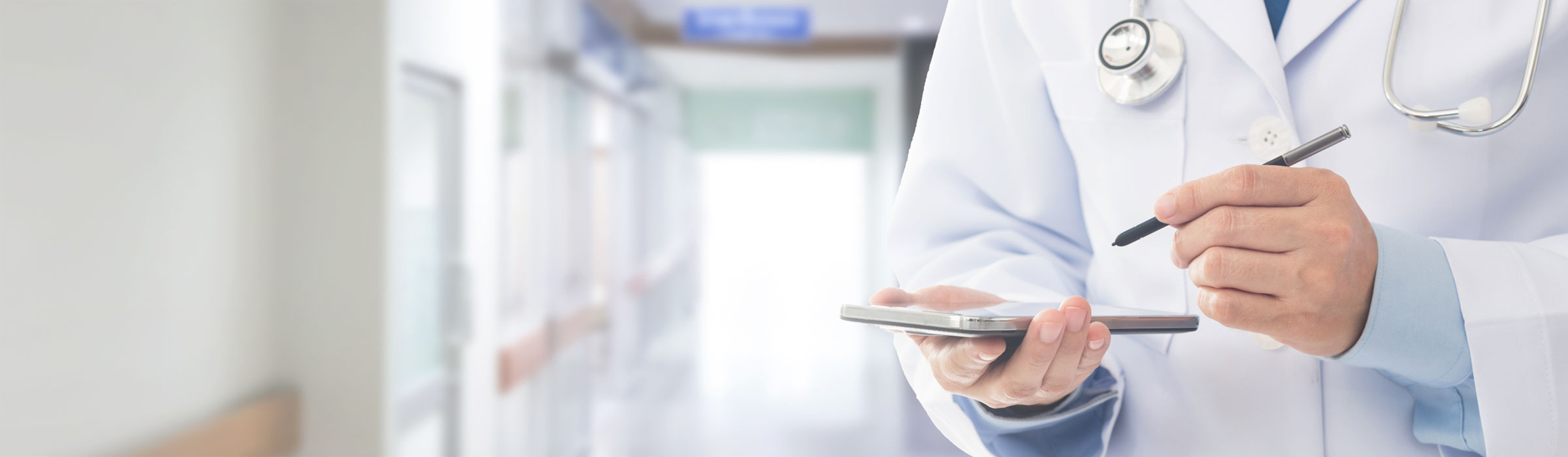 Close up of Doctor writing on tablet