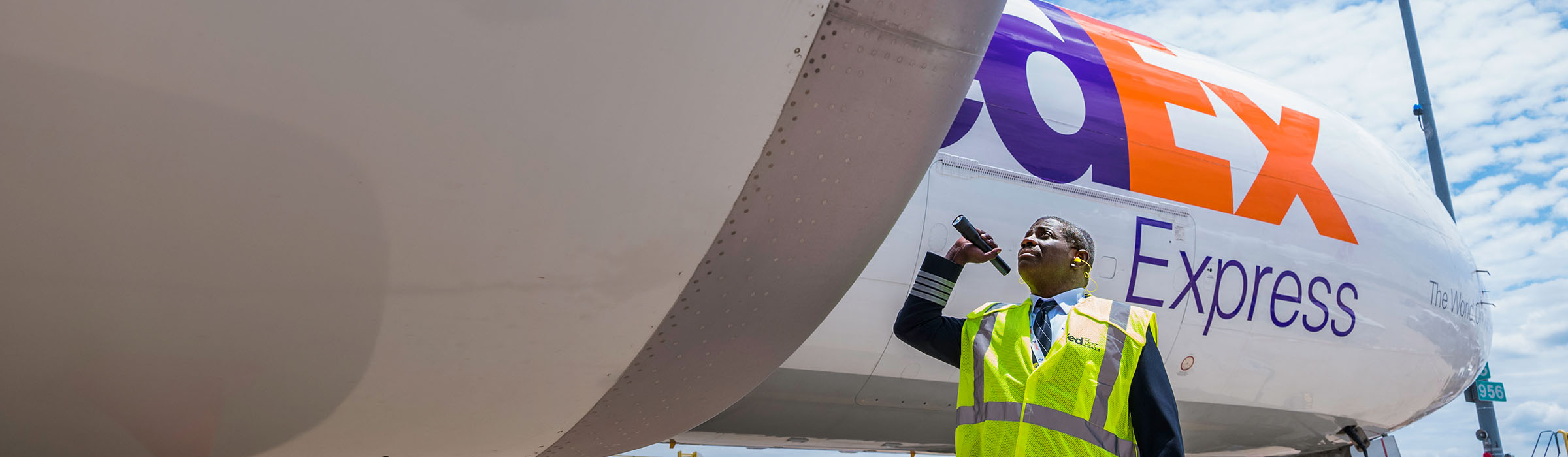 Pilot inspecting plane before takeoff