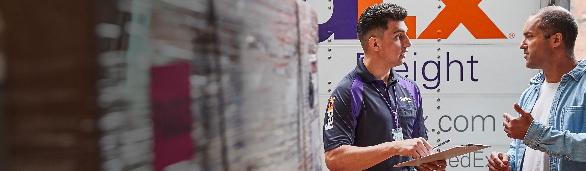 FedEx Freight Employee talking to customer
