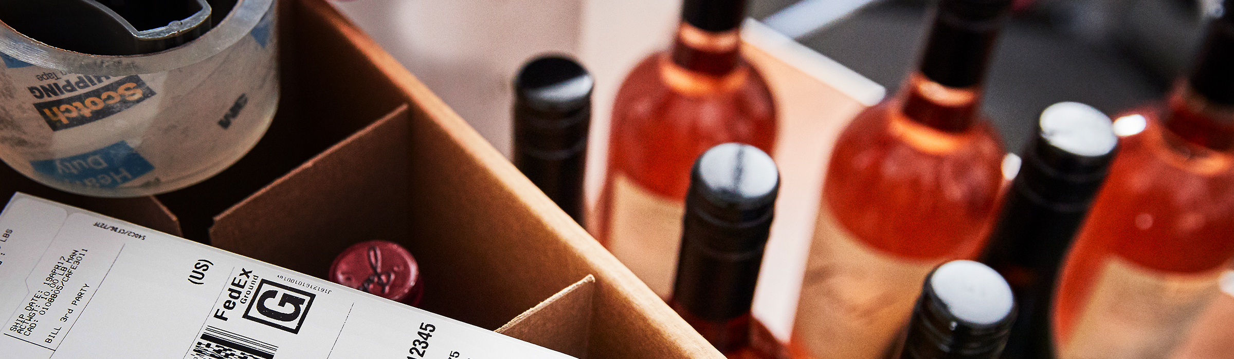 Bottles of wine packed in a box for shipping.