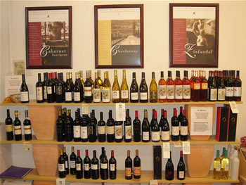 Bottles of wine on racks at a wine store.