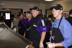 2008 - Denny Hamlin serving food to those in need
