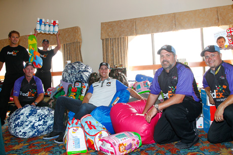 2014 - Denny Hamlin on a beanbag chair, posing with fans