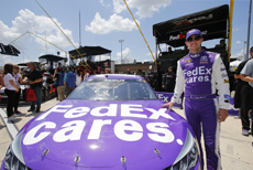 2015 Denny Hamlin posing with the #11 FedEx Toyota Camry