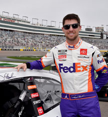 Denny Hamlin standing by his car after race