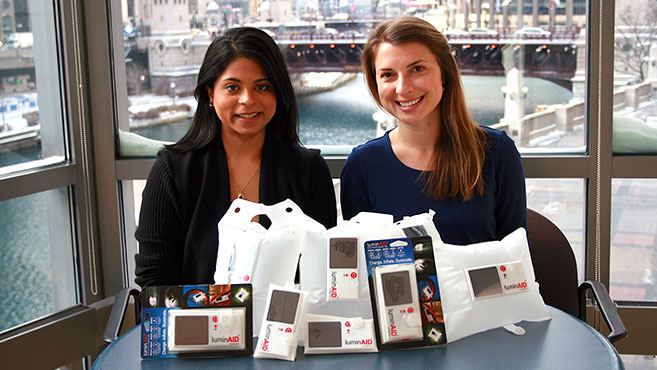 Business ladies displaying their product