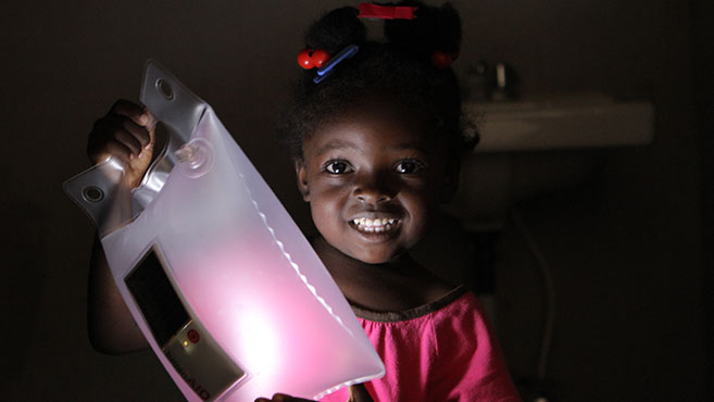 Little girl holding a light