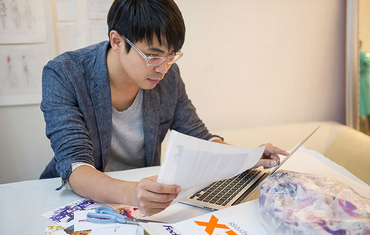 man reviewing fedex shipping label
