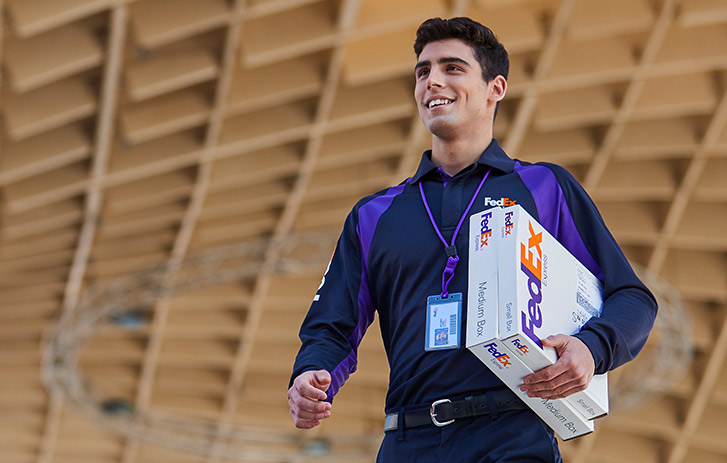 fedex courier holding white box