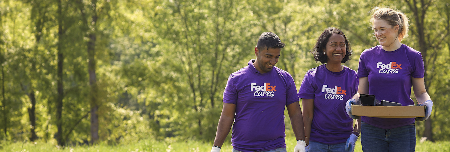 Volunteers walking across a field