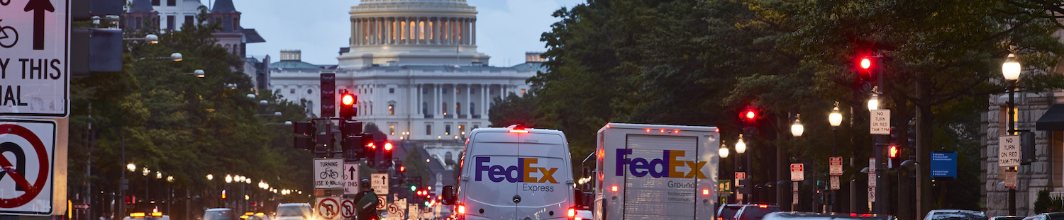 Two FedEx Trucks and the US Capitol