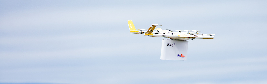 Wing Drone in the Sky with FedEx Package